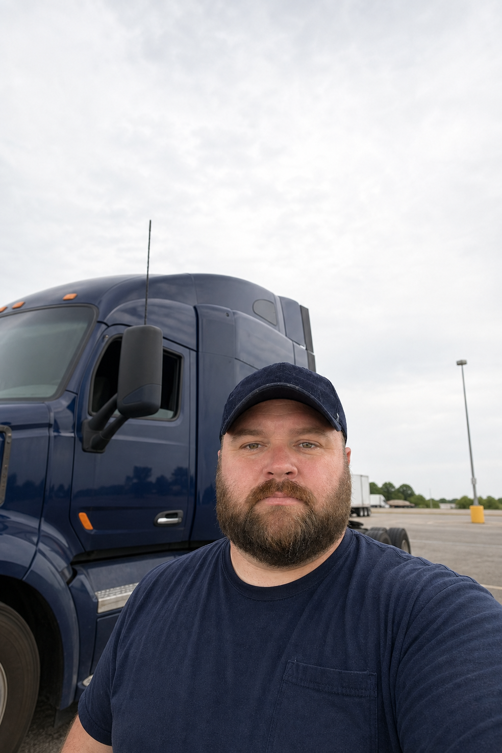 Cover of Mile After Mile featuring Garrett beside a navy semi tractor